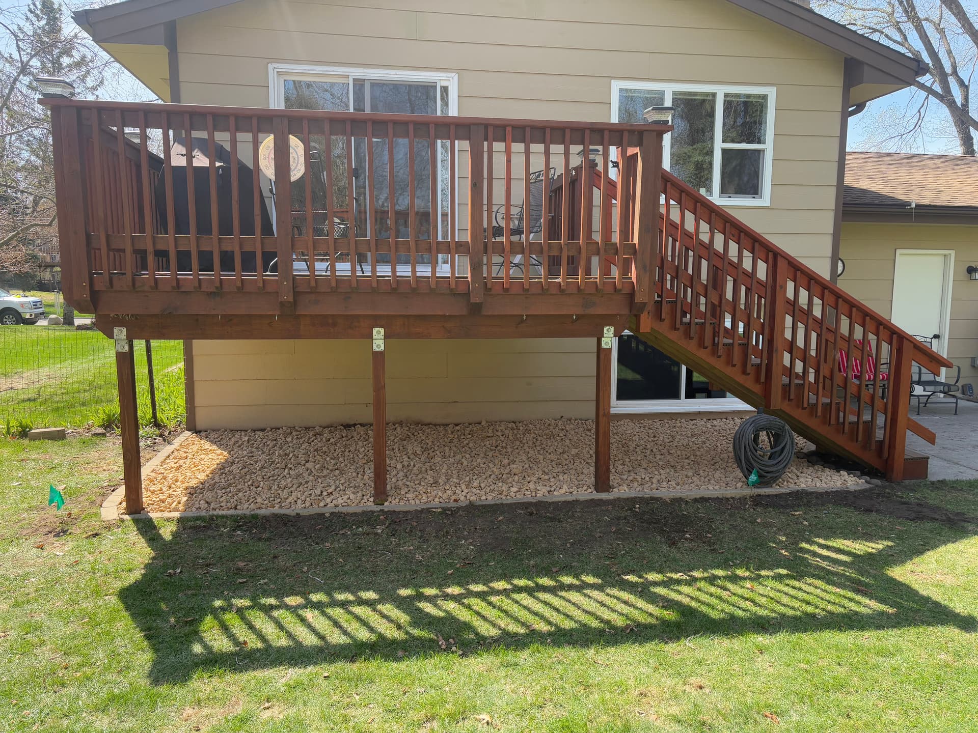 Gallery photos for Old Mulch Swapped for a Clean Rock Bed Under This Deck: Image #3